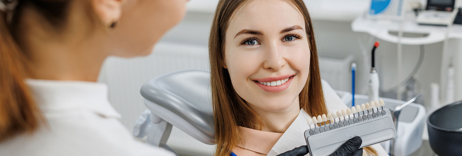 Woman smiling with Porcelain Veneers