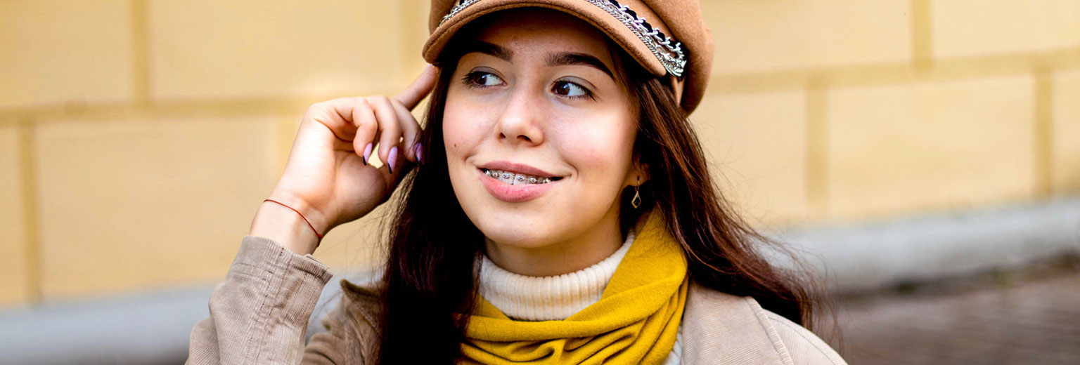 Woman Smiling with Orthodontics Treatment