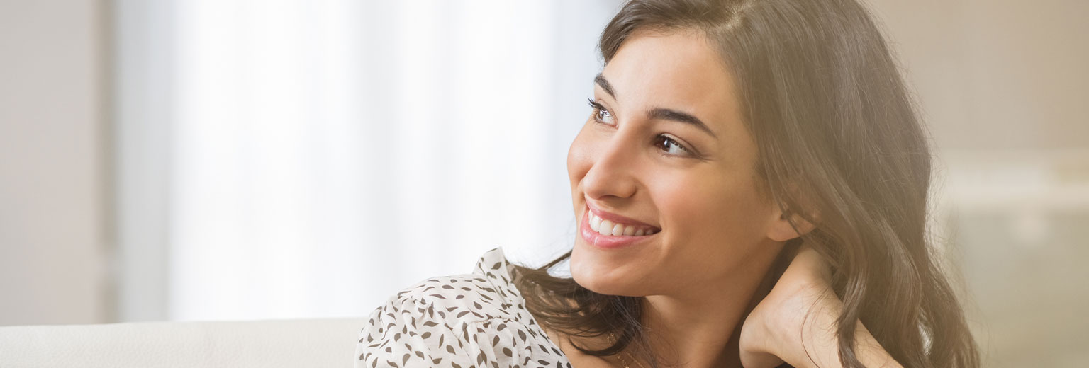 Beautiful woman smiling after Care Following Orthodontics – Retainers