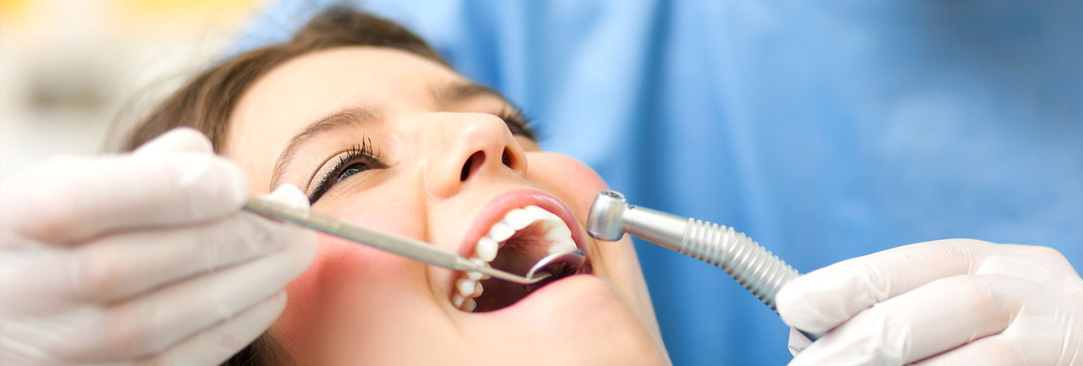 Beautiful woman having Dental Emergency Treatment