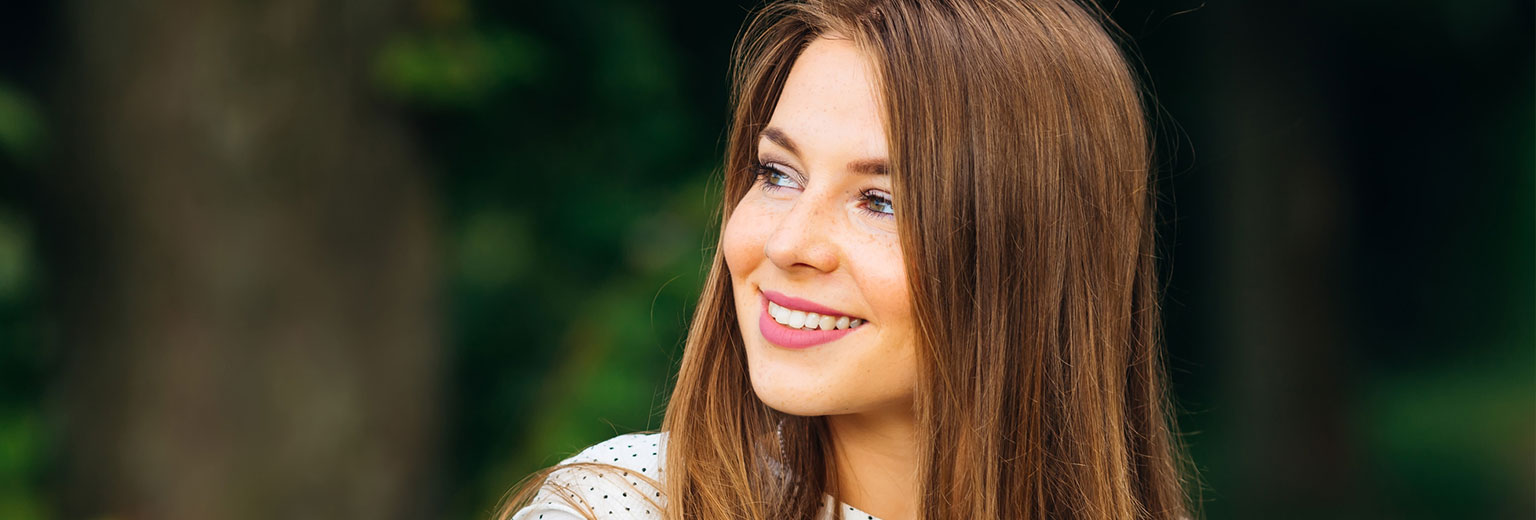 Woman smiling after Periodontal Disease Treatments