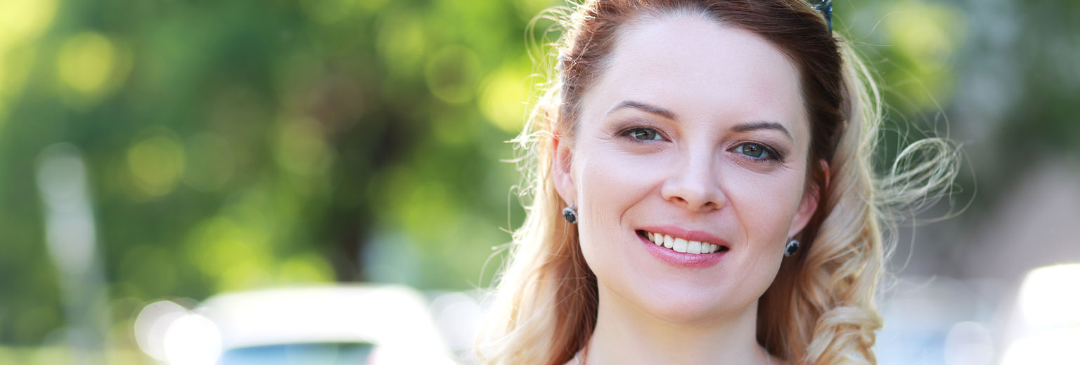 Woman smiling after Periodontal Disease Treatment