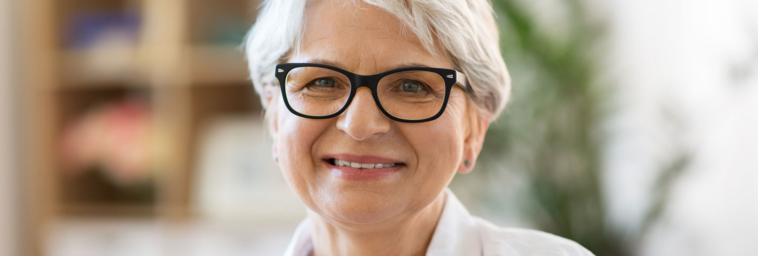 Senior woman smiling after Gum Recession