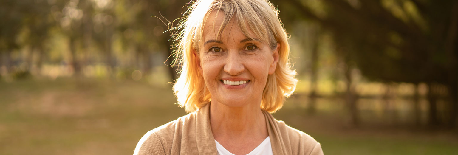 Senior woman smiling after Periodontal Scaling & Root Planing