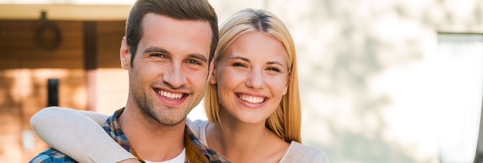 Couple is smiling after Root Canal Therapy