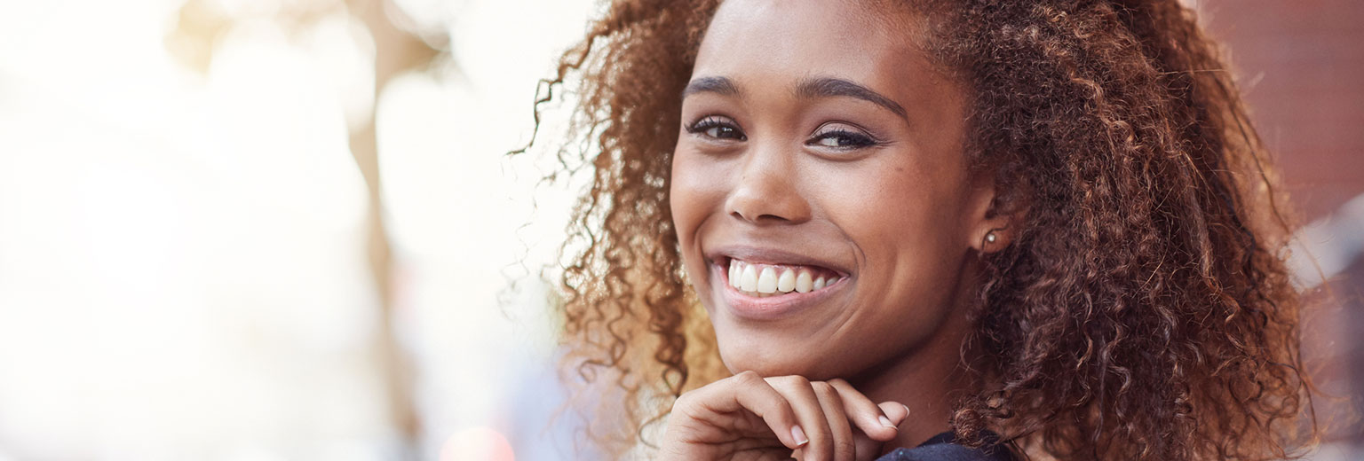 Woman smiling after Empress® Restorations