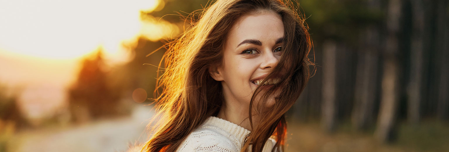 Woman smiling after TMJ treatment